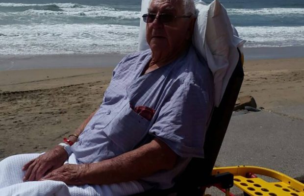 Paramedics stop by the beach to let a patient see the ocean