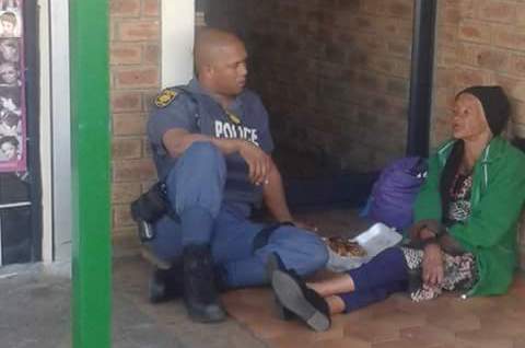 Policeman helps homeless woman cape town 1