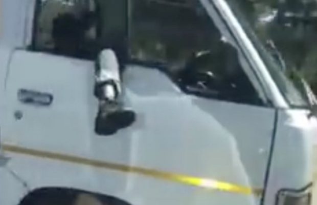 Taxi Driver Leg out the window