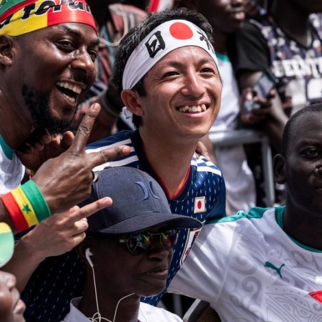 Japan And Senegal fans sing together after the World Cup Match