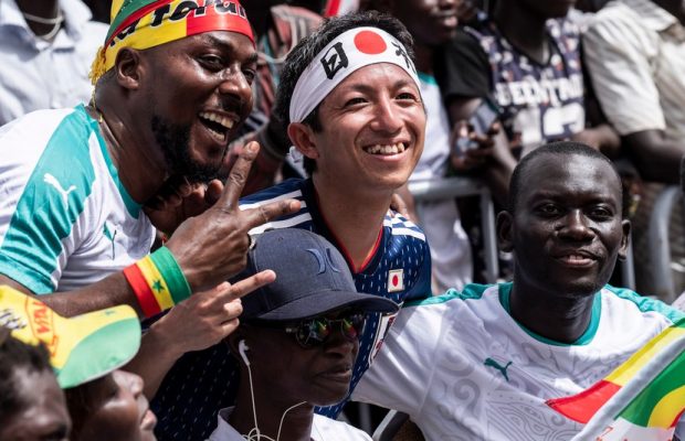 Japan And Senegal fans sing together after the World Cup Match