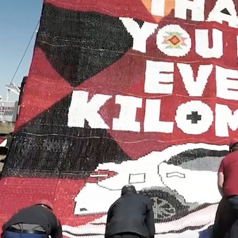A love letter billboard created completely out of beads