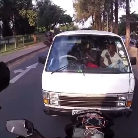 Must Watch: Biker hailed a hero for stopping a taxi from illegally driving on the wrong side of the road!