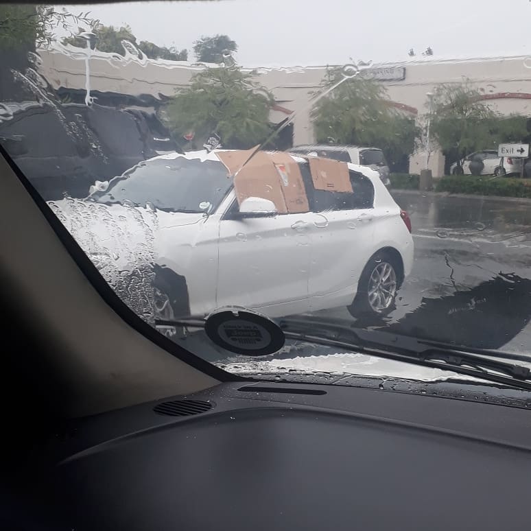 Car guards in a Johannesburg shopping centre have saved the day... after a customer left her windows open during a heavy storm.