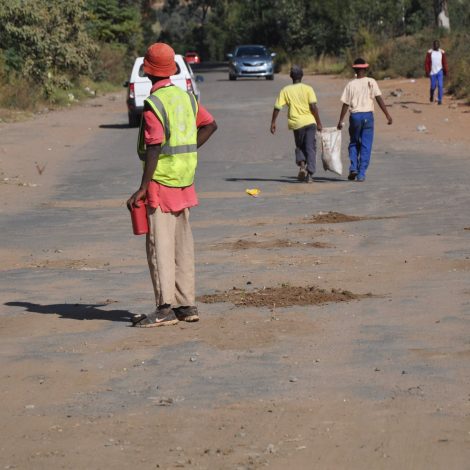 Pics: Group of South Africans are fixing potholes in their community!